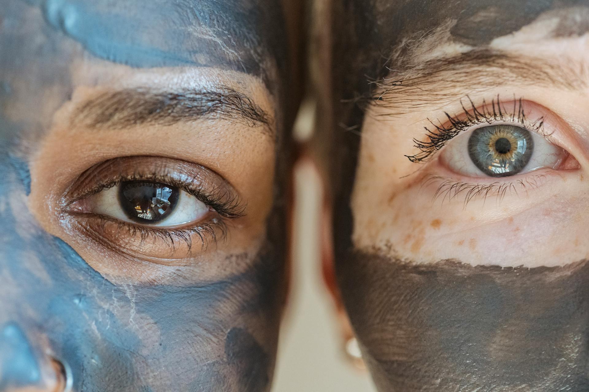 Two women with clay mask on face